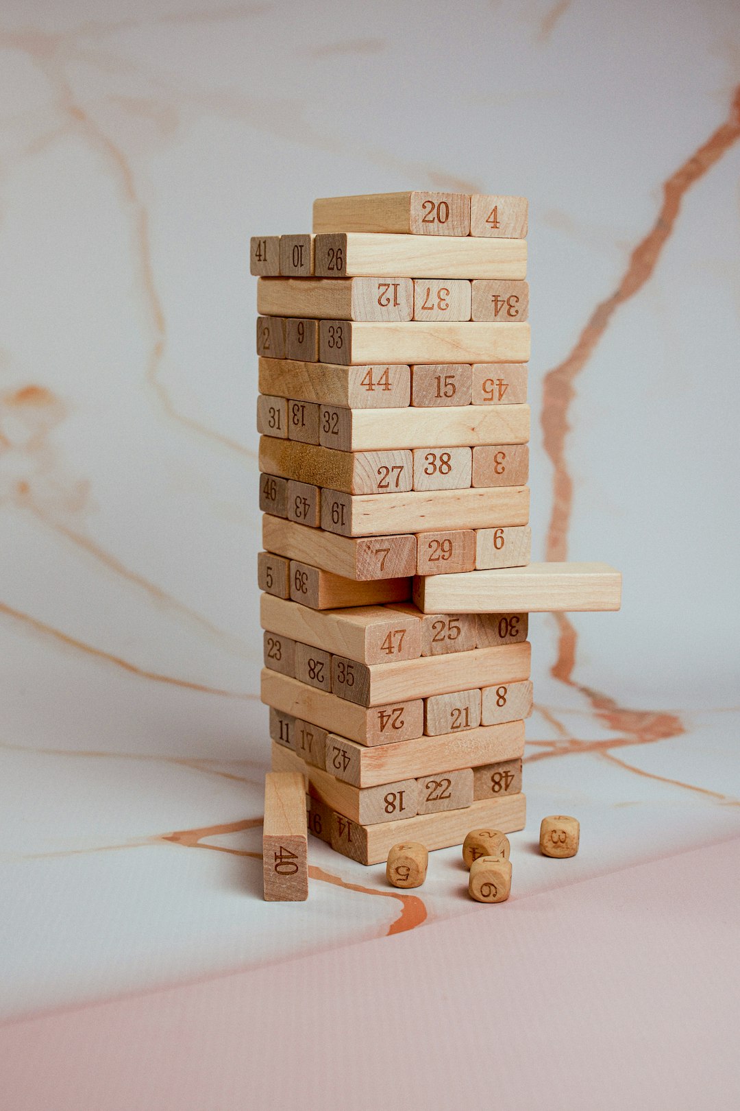 a-stack-of-wooden-blocks-with-numbers-on-them-it15xdxmlxw